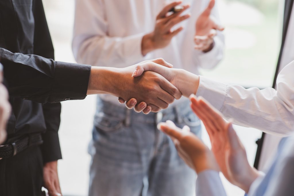 Business man offer and give hand for handshake in office. Successful job interview. Apply for loan i